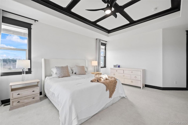 bedroom featuring baseboards, a ceiling fan, and light colored carpet