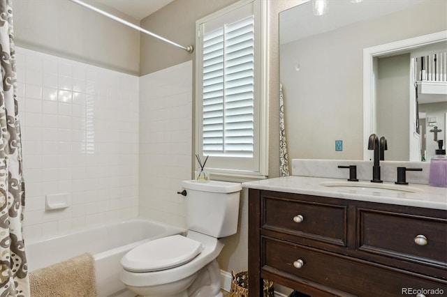 full bath featuring vanity, toilet, and shower / bath combo