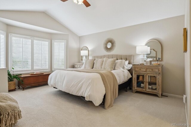 bedroom featuring lofted ceiling, multiple windows, and carpet floors