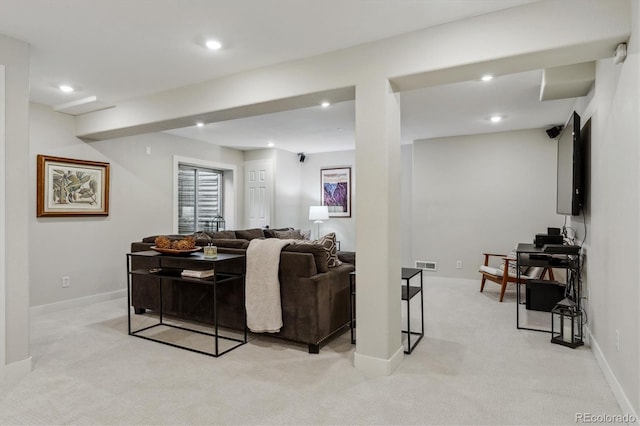 living area with light colored carpet, visible vents, and recessed lighting