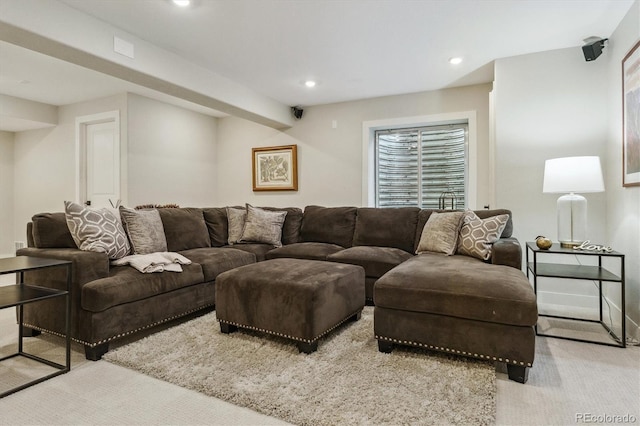carpeted living area with recessed lighting