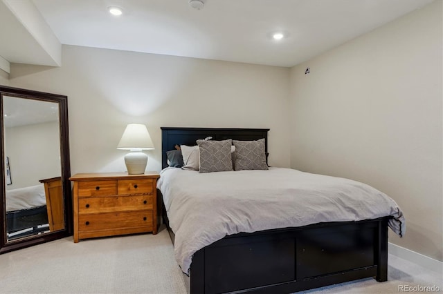 bedroom with baseboards, light carpet, and recessed lighting