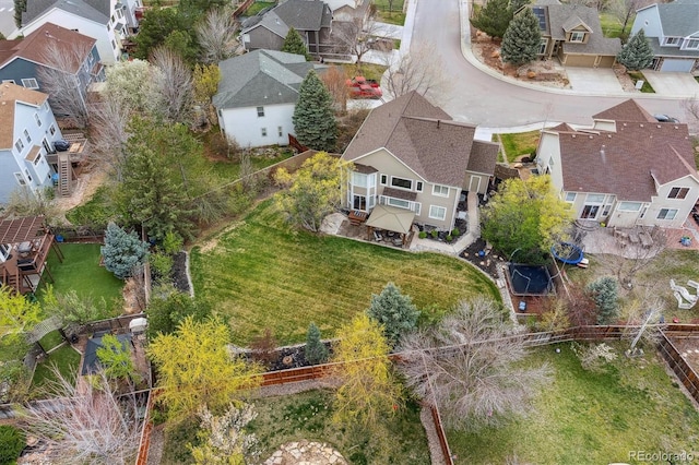 birds eye view of property with a residential view