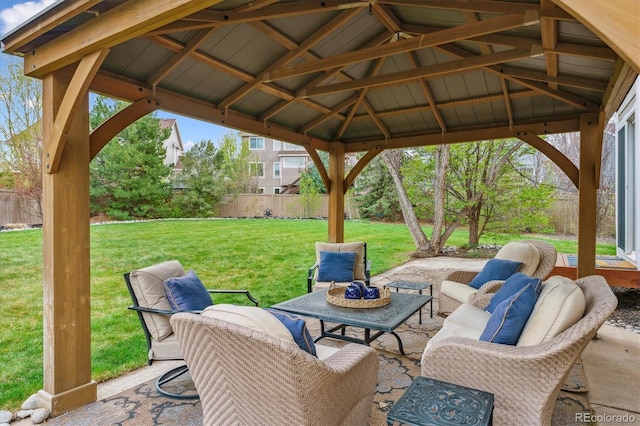 view of patio / terrace featuring an outdoor hangout area, a gazebo, and fence