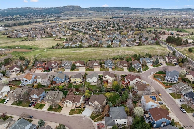 drone / aerial view featuring a mountain view and a residential view