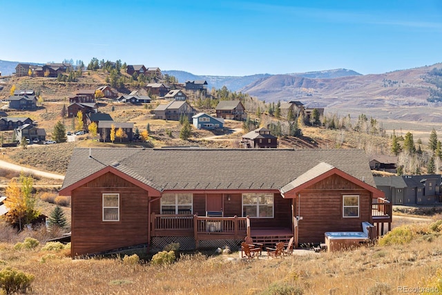 exterior space featuring a deck with mountain view