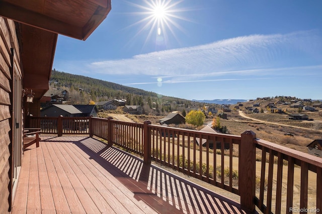 wooden terrace featuring a mountain view