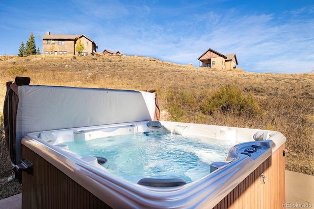 exterior space with a hot tub