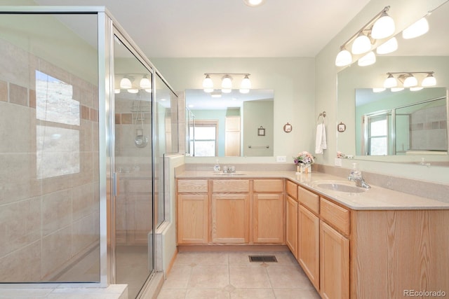 bathroom with vanity, tile patterned floors, and walk in shower