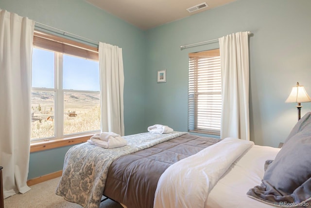 bedroom with light colored carpet