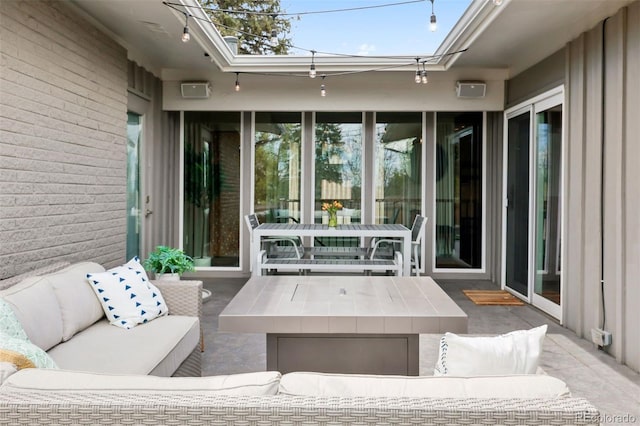 view of patio / terrace with outdoor dining area and an outdoor hangout area