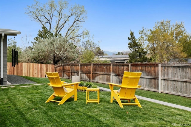 exterior space featuring a lawn and a fenced backyard