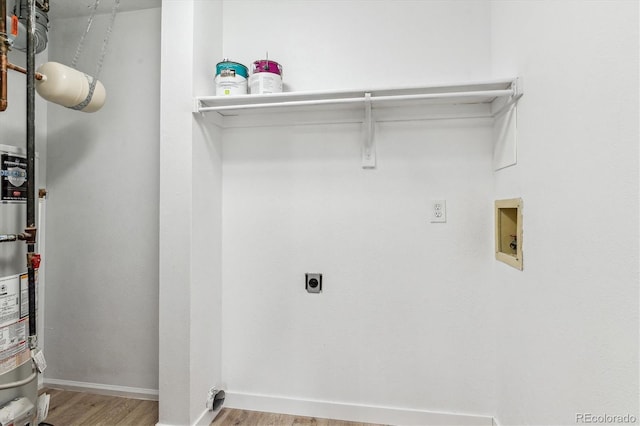 laundry area featuring baseboards, laundry area, hookup for a washing machine, wood finished floors, and electric dryer hookup