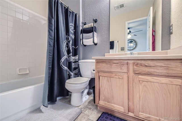 full bathroom with ceiling fan, vanity, shower / tub combo with curtain, and toilet