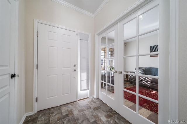 foyer featuring crown molding and french doors