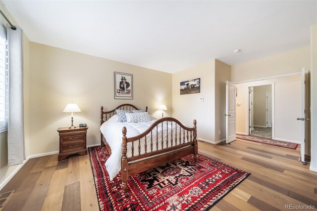 bedroom featuring light hardwood / wood-style floors