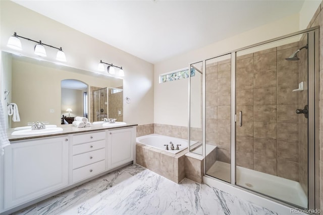 bathroom featuring vanity and separate shower and tub