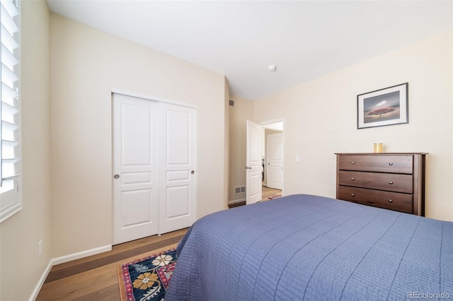 bedroom featuring a closet and hardwood / wood-style floors