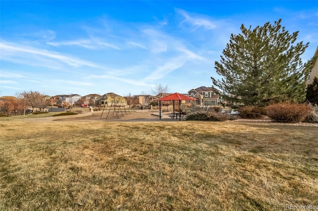 view of yard with a gazebo and a playground