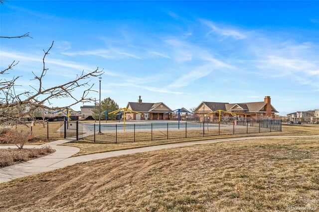 view of home's community with a yard