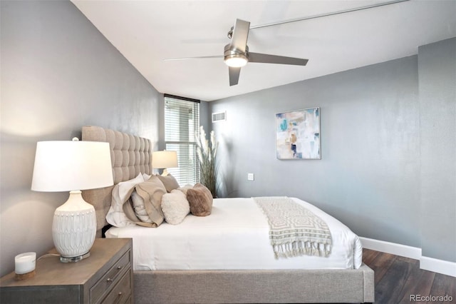 bedroom featuring ceiling fan and dark hardwood / wood-style flooring