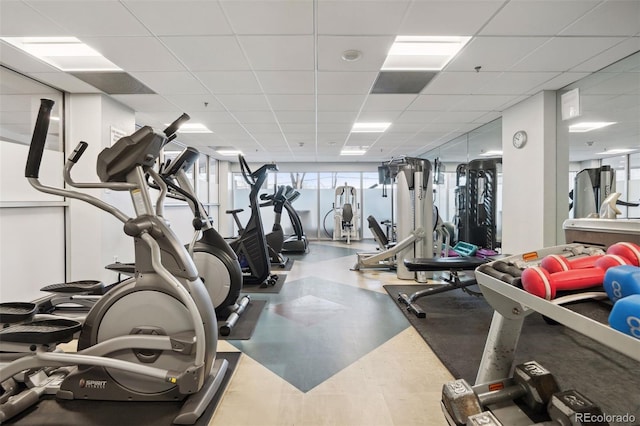 workout area with a drop ceiling