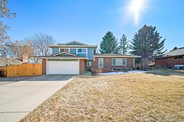 tri-level home featuring fence, brick siding, concrete driveway, and a gate