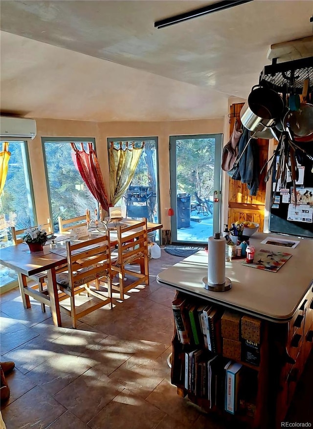 dining space with a wall mounted AC