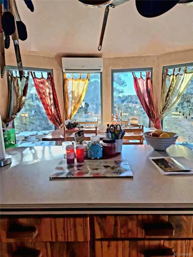 dining area featuring a wall unit AC