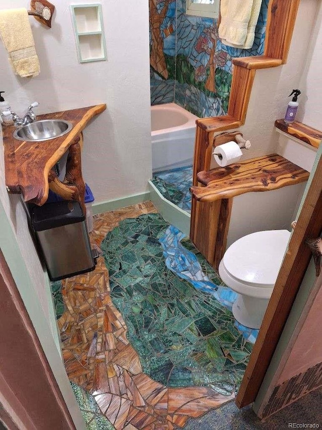 bathroom with toilet and sink