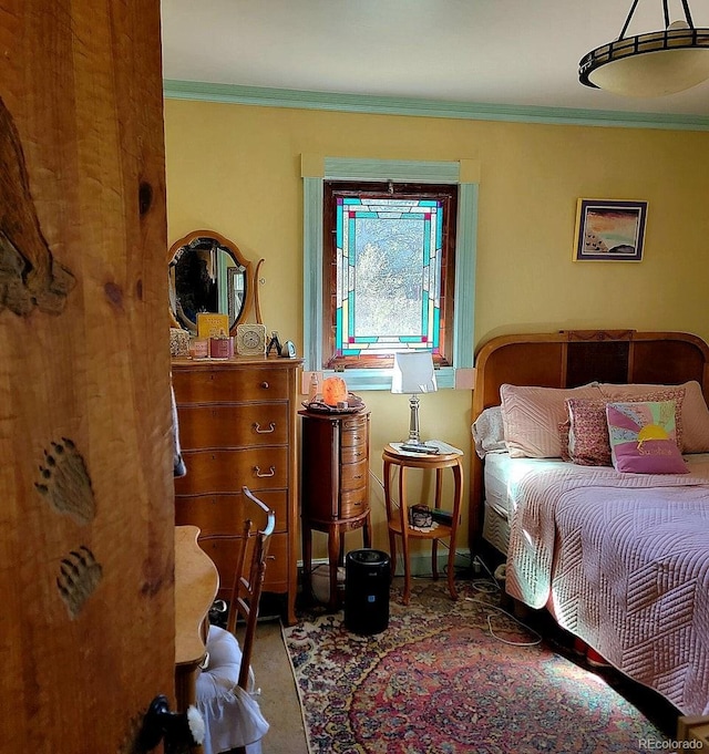 bedroom featuring crown molding