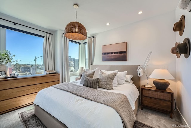 bedroom featuring baseboards, light colored carpet, and recessed lighting