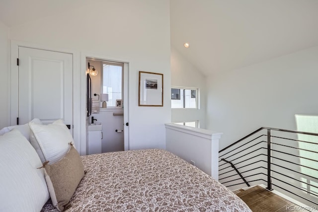 bedroom featuring high vaulted ceiling, recessed lighting, and ensuite bathroom