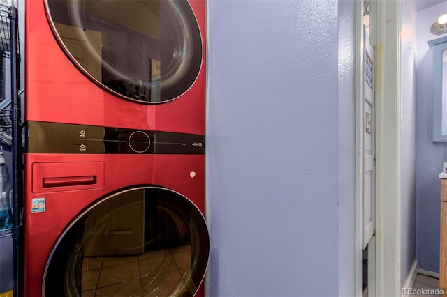 laundry area with stacked washing maching and dryer and laundry area