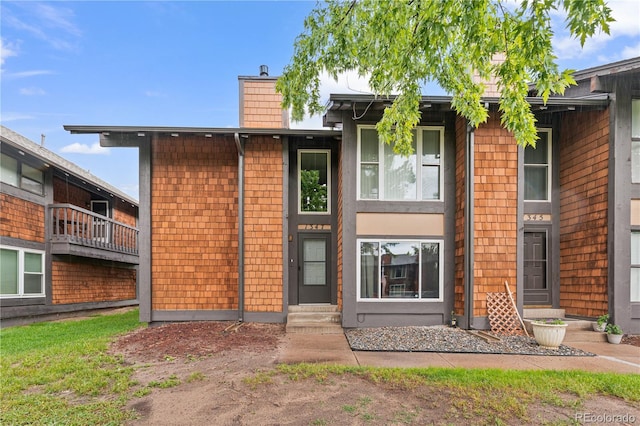 1347 S Crystal Way, Aurora, CO 80012 - view of front of home featuring a chimney and entry steps