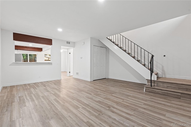 1347 S Crystal Way, Aurora, CO 80012 - unfurnished living room featuring stairway, wood finished floors, recessed lighting, and baseboards