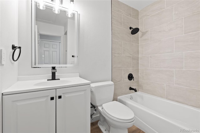 1347 S Crystal Way, Aurora, CO 80012 - bathroom with toilet, vanity, shower / washtub combination, and wood finished floors