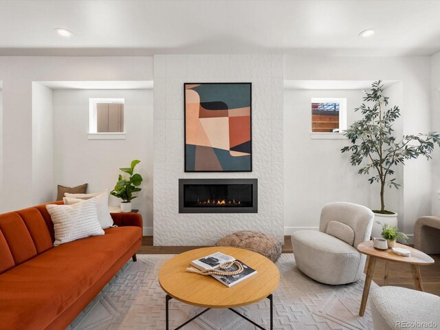 3640 Lipan St, Denver, CO 80211 - living area with a tiled fireplace, baseboards, recessed lighting, and wood finished floors
