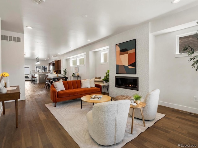 3640 Lipan St, Denver, CO 80211 - living area with a large fireplace, dark wood finished floors, baseboards, and recessed lighting