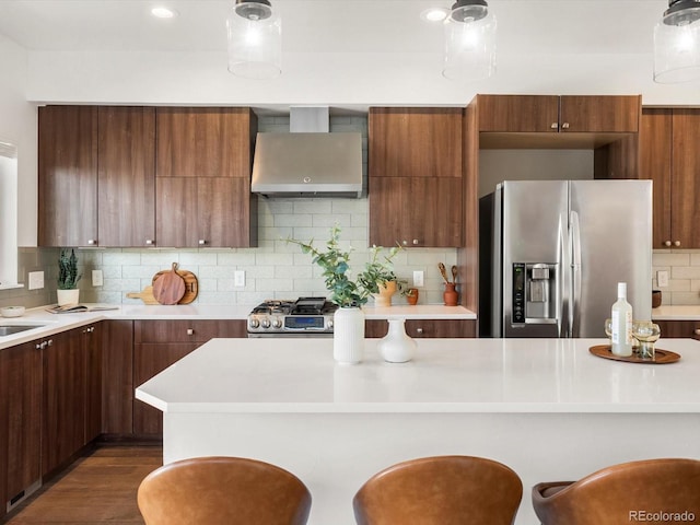 3640 Lipan St, Denver, CO 80211 - kitchen featuring stainless steel appliances, wall chimney range hood, modern cabinets, and light countertops