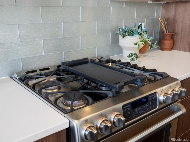 3640 Lipan St, Denver, CO 80211 - kitchen view of stainless steel gas stove and backsplash