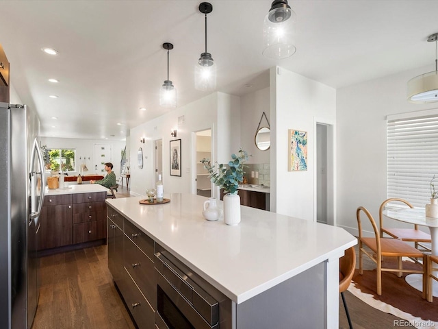 3640 Lipan St, Denver, CO 80211 - kitchen featuring stainless steel appliances, dark wood-style flooring, light countertops, and recessed lighting