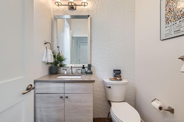 3640 Lipan St, Denver, CO 80211 - half bath featuring toilet, vanity, and tile walls