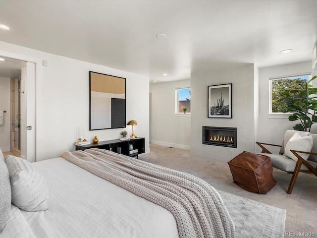 3640 Lipan St, Denver, CO 80211 - bedroom with carpet flooring, a glass covered fireplace, recessed lighting, and baseboards