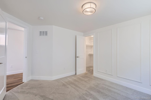 3640 Lipan St, Denver, CO 80211 - unfurnished bedroom with carpet, baseboards, and a spacious closet