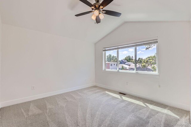 3640 Lipan St, Denver, CO 80211 - spare room with vaulted ceiling, light colored carpet, baseboards, and a ceiling fan