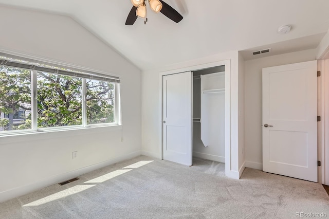 3640 Lipan St, Denver, CO 80211 - unfurnished bedroom with light carpet, vaulted ceiling, baseboards, a closet, and a ceiling fan