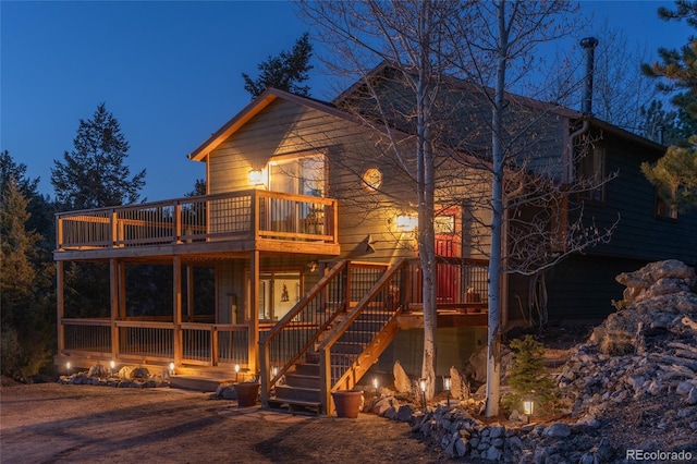 234 Bailey Dr, Bailey, CO 80421 - back of house with stairway and a wooden deck