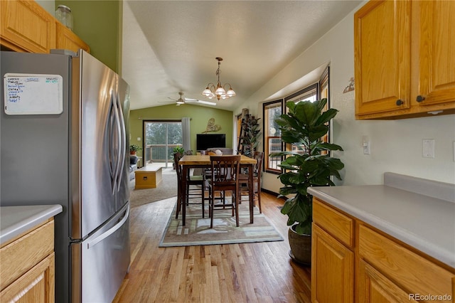 234 Bailey Dr, Bailey, CO 80421 - dining space with wood finished floors, lofted ceiling, a chandelier, and ceiling fan