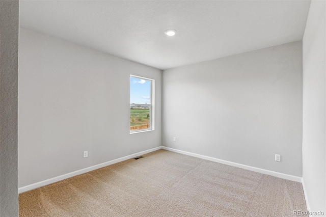 spare room featuring carpet flooring